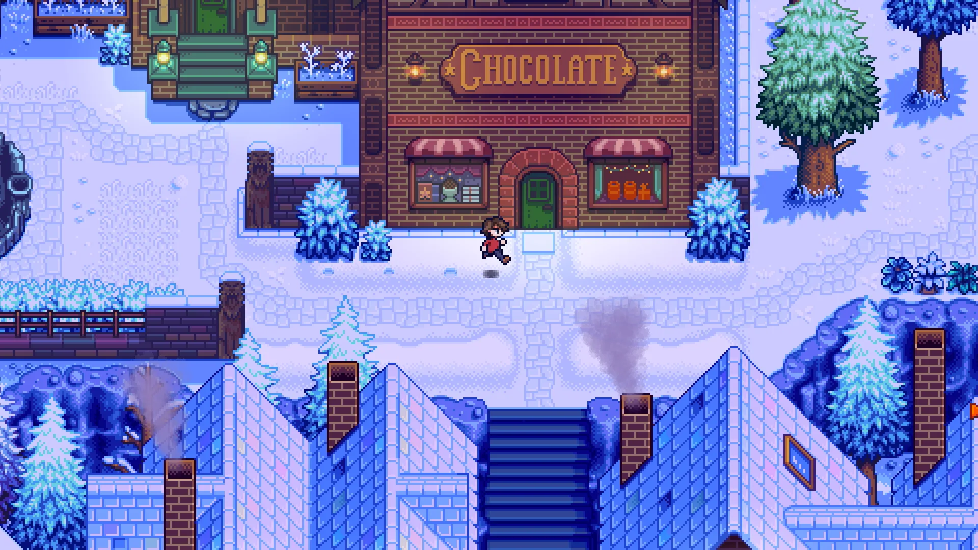 Cena em pixel art de Haunted Chocolatier: a loja de tijolos com a placa CHOCOLATE numa cidade coberta de neve, com o personagem do jogador caminhando na calçada em frente